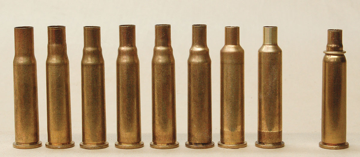 Left to right are the incremental case-forming steps in making 22-30-30 brass; at far right is a crushed case illustrating the need for the incremental forming steps.